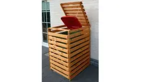 Die Mülltonnenabtrennung "Reso" aus massivem Kiefernholz. Farbe: Honigbraun