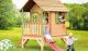 Bietet viel Platz für die Kids: Das TÜV-geprüfte 172 x 285 x 230 cm Kinderhaus Holz mit Veranda und Rutsche